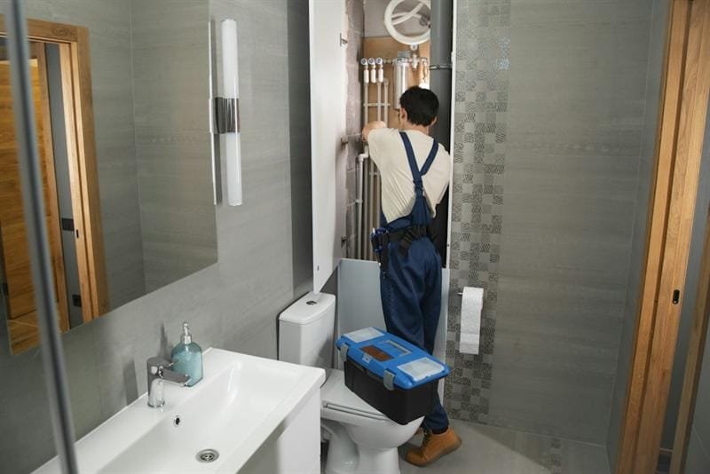 Licensed Arkansas plumbers diagnosing residential plumbing systems